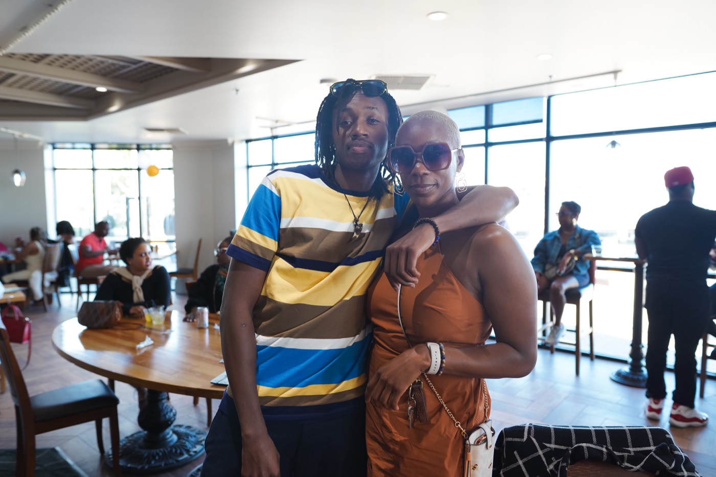 Friends celebrating at an Afrobeats Miami gathering